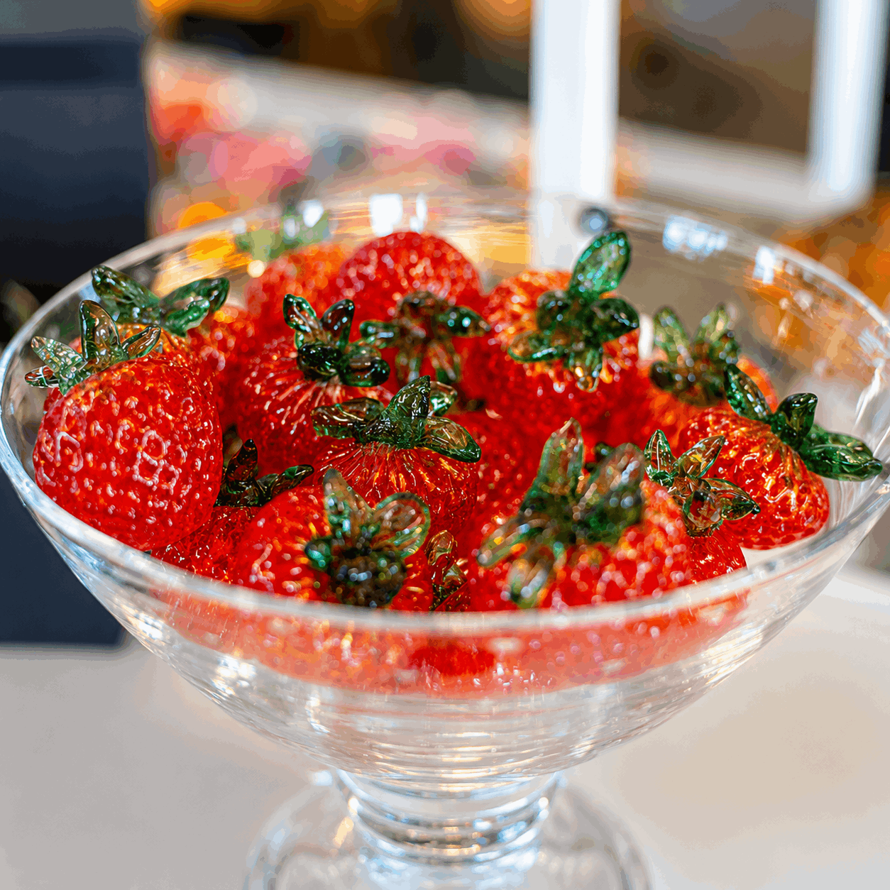 glass strawberries in a bowl